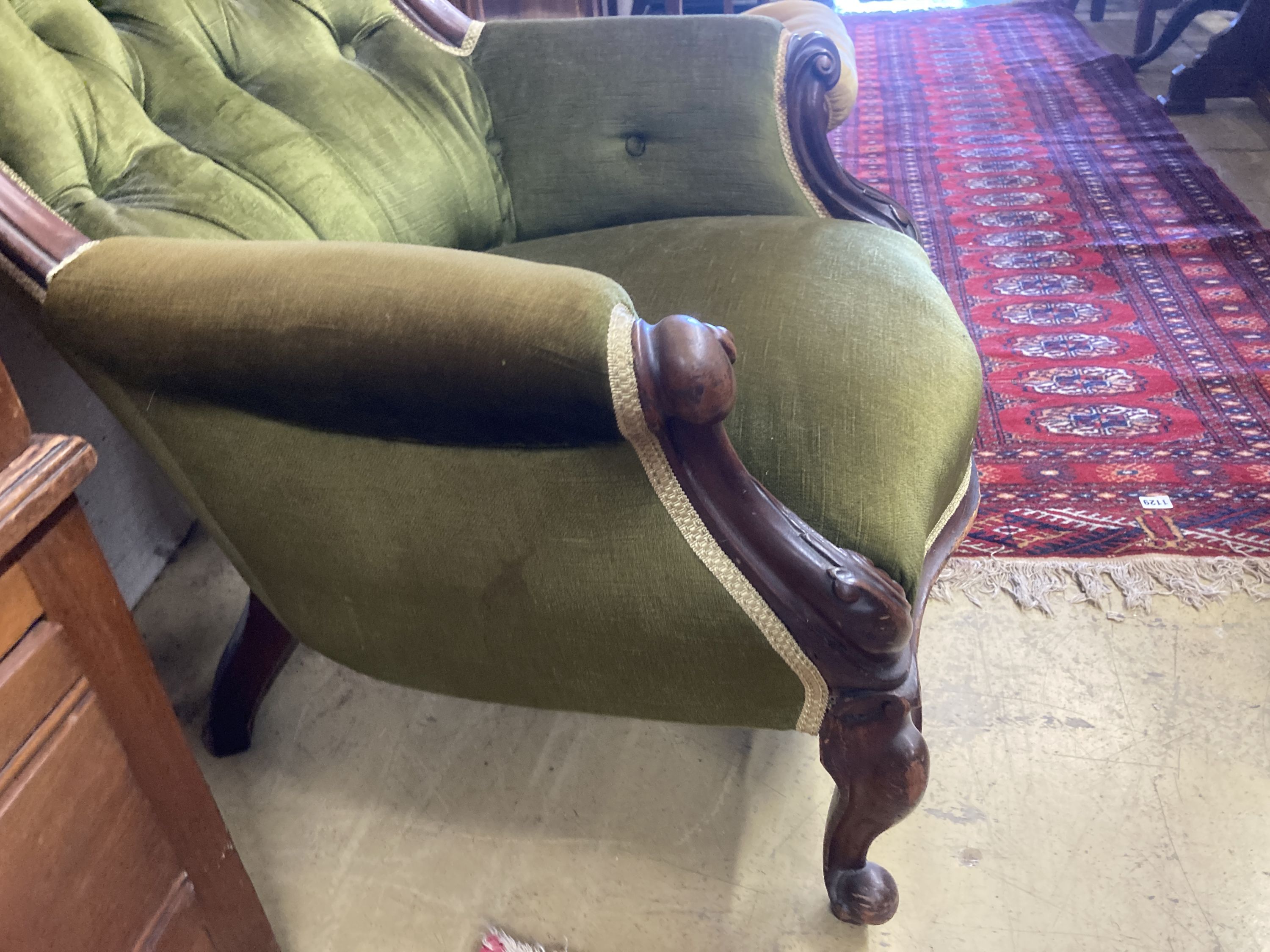 A Victorian mahogany spoonback armchair, width 88cm, depth 80cm, height 94cm
